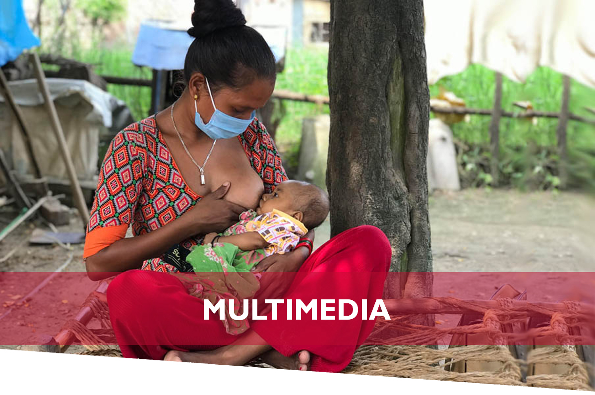 Multimedia | A mother breastfeeds her infant.