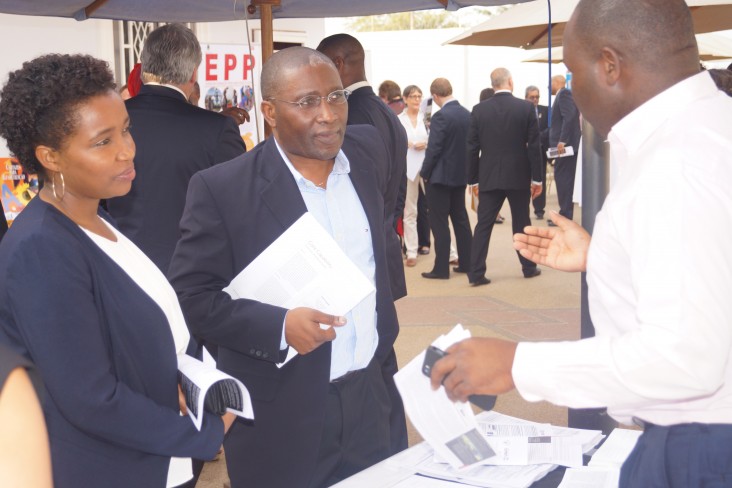 USAID implementer partner discusses potential activities with a private company representative.