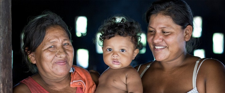 Close up photo of two women with a child