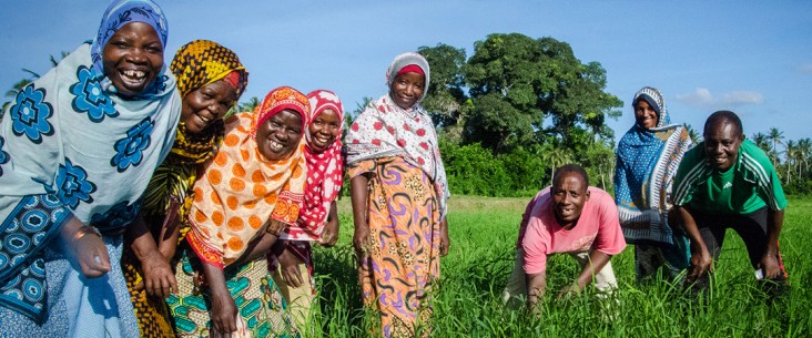 Women and Men in a field