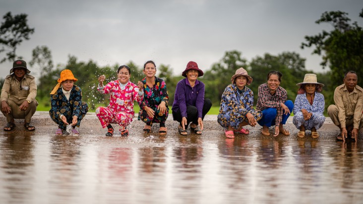 a group of people splashing water