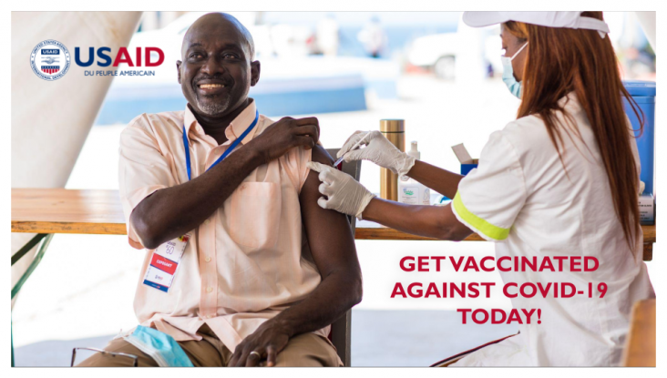 Man gets vaccinated against COVID-19 at a USAID-sponsored clinic