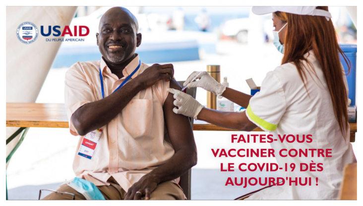 Man gets vaccinated against COVID-19 at a USAID-sponsored clinic