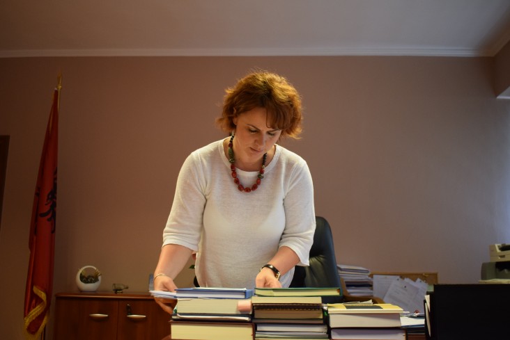 Chief Judge Enkeledi Hajro of the Tirana District Court reviews her documents.