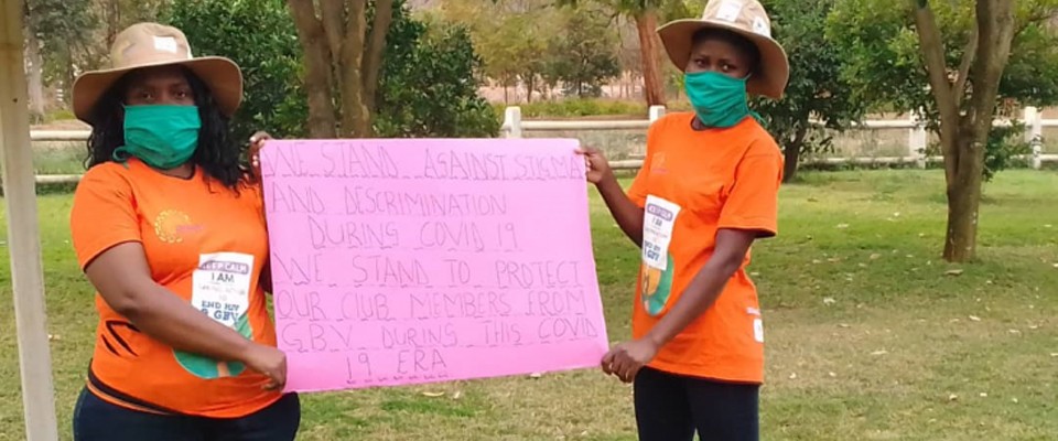 Women holding a sign