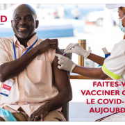 Man gets vaccinated against COVID-19 at a USAID-sponsored clinic