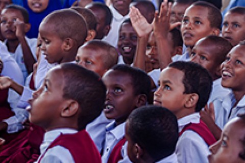 Somalia children listen attentively to Somali folktales under the storytelling tent at the Mogadishu Book Fair. / Ismail Taxta, UNICEF/Somalia