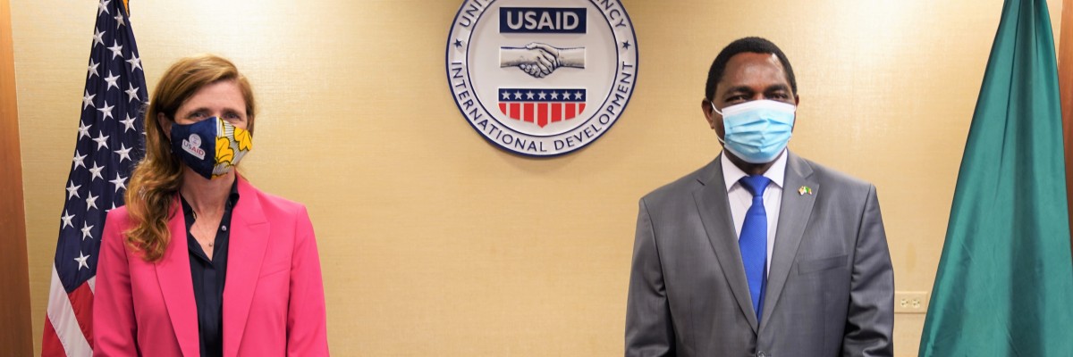 Samantha Power and Hakainde Hichilema stand near each other for a photo after meeting.