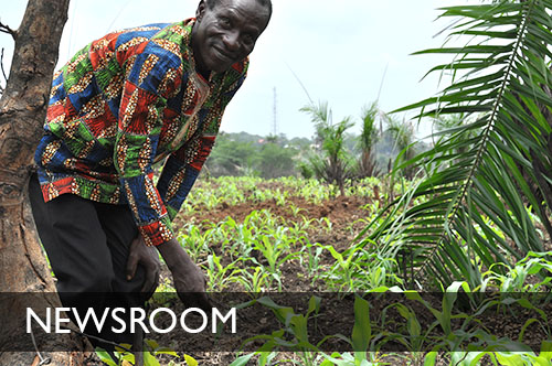 Photo of a farmer in a field. Click to view Newsroom